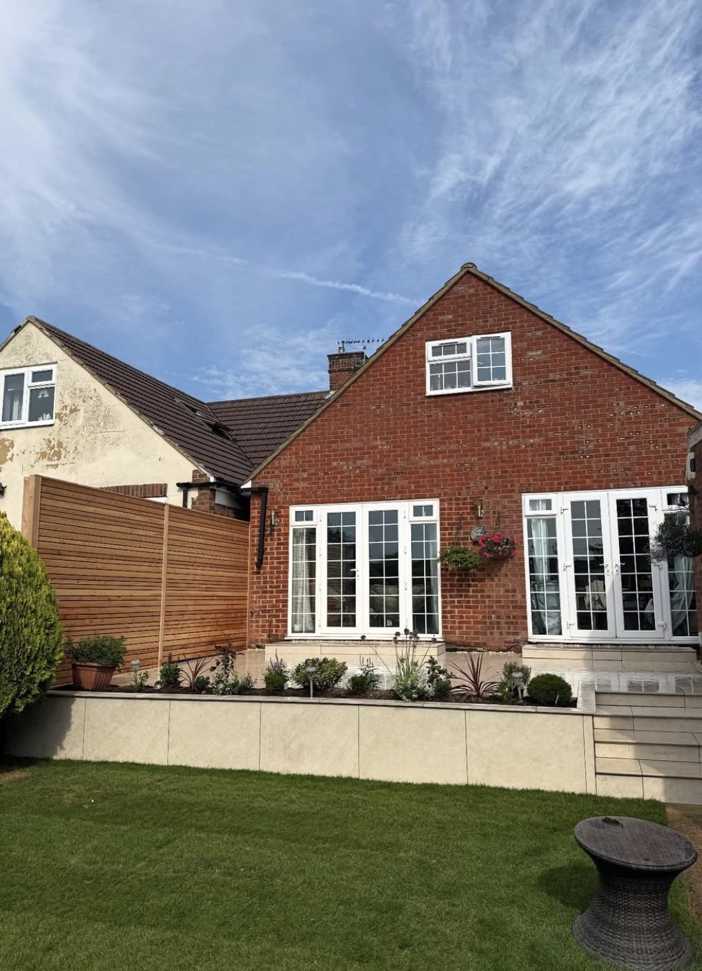 Contemporary slatted screening and porcelain raised beds by Lux Landscape Gardeners