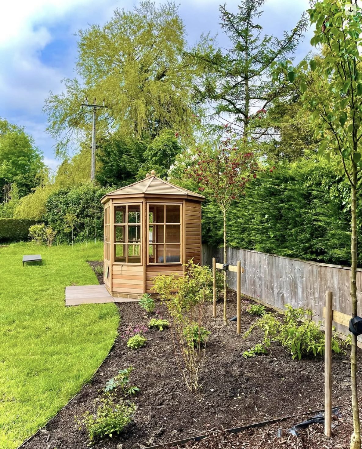 New planting beds and borders around a garden summerhouse in Hertfordshire